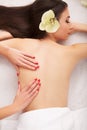 Spa Stone Massage. Beautiful Woman Getting Spa Hot Stones Massage in Spa Salon. Beauty Treatments Outdoor. Nature Royalty Free Stock Photo