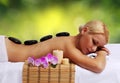 Spa Stone Massage. Blonde Woman Royalty Free Stock Photo