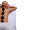 Spa Stone Massage. Blonde Woman Getting Hot Stones Massage Royalty Free Stock Photo