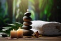 Spa stones with candles and towel on wooden table against blurred background, Spa concept with eucalyptus oil and eucalyptus leaf Royalty Free Stock Photo