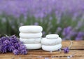 Spa stones, fresh lavender flowers and bath salt on wooden table outdoors Royalty Free Stock Photo