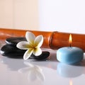 Spa stones and lit candle Royalty Free Stock Photo