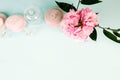 Spa stones, oil bottles and pink flower on white background Royalty Free Stock Photo