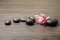 Spa stones with orchid flower Royalty Free Stock Photo