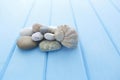 Spa stones on table light background and large sea shell Royalty Free Stock Photo