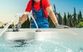 Spa Technician Performing Hot Tub Checks Royalty Free Stock Photo