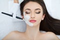 Spa therapy for young woman having facial mask at beauty salon - Royalty Free Stock Photo