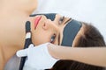 Spa therapy for young woman having facial mask at beauty salon - Royalty Free Stock Photo