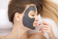 Spa therapy for young woman having facial mask at beauty salon - Royalty Free Stock Photo
