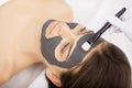 Spa therapy for young woman having facial mask at beauty salon - Royalty Free Stock Photo