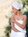 Spa, touch skin and woman in towel for beauty, healthy skincare and wellness outdoor. Relax, body and young person at Royalty Free Stock Photo