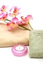 Spa towels, candle and pink orchid Royalty Free Stock Photo