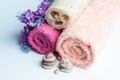 Spa towels rolls, flower and stones.