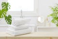 Spa towels on table with copy space in blurred bathroom Royalty Free Stock Photo