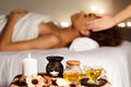 Spa treatment. Afro girl enjoying aroma therapy and face massage Royalty Free Stock Photo