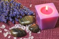 Spa treatment: aromatherapy candle, seasalt and massage stone Royalty Free Stock Photo