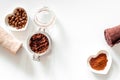 Spa treatment. Coffee scrub on white background top view copyspace