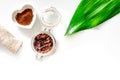 Spa treatment. Coffee scrub on white background top view copyspace