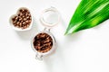 Spa treatment. Coffee scrub on white background top view copyspace