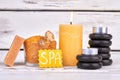 Spa treatment concept still life composition with burning candle. Royalty Free Stock Photo
