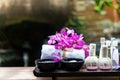 Spa treatment and product for female feet and manicure nails spa with pink flower, copy space, soft and select focus,