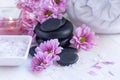 Spa treatment and product for femalespa with pink flower and rock stone, copy space,