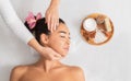 Spa Treatment. Relaxed Asian Lady Enjoying Face Massage And Aromatherapy In Salon Royalty Free Stock Photo