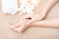 spa and treatment skin hand, Woman applying organic moisturizing hand cream, hand skin care concept, winter, female skin Royalty Free Stock Photo