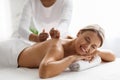 Spa Treatments. Beautiful Middle Aged Lady Enjoying Back Massage In Luxury Salon Royalty Free Stock Photo