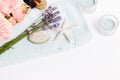 Spa and wellness background, lavender, pink roses, cosmetics on a towel