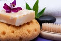 Spa Wellness Concept. Foam Sea Sponge, Almond Goat`s milk Soap, Natural Bristle Wooden Brush, Basalt Stones, Bamboo and Orchid