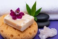 Spa Wellness Concept. Natural Foam Sea Sponge, Goat milk Soap, Basalt Stones, Bamboo, Orchid and Himalayan Clear Quartz Cluster