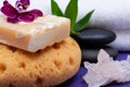 Spa Wellness Concept. Natural Foam Sea Sponge, Goat milk Soap, Basalt Stones, Bamboo, Orchid and Himalayan Clear Quartz Cluster