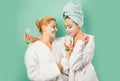 Spa and wellness. Girls friends sisters making clay facial mask. Anti age mask. Stay beautiful. Skin care for all ages Royalty Free Stock Photo