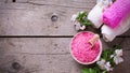 Spa or wellness organic product. Pink sea salt in bowl, towels Royalty Free Stock Photo