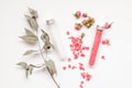 Spa or wellness. Pink salt with a rose and white sea salt in cones on a light background. Rose petals and dried buds