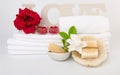 Spa wellness with red rose candles ,white towel ,milk soap and sea shell on white background