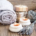 Spa and Wellness Setting with burning Candles and Lavander Bouquet Royalty Free Stock Photo