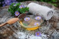 Spa and wellness setting with sea salt, oil essence, flowers and Royalty Free Stock Photo