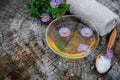 Spa and wellness setting with sea salt, oil essence, flowers Royalty Free Stock Photo