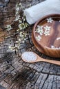 Spa and wellness setting with sea salt, oil essence, flowers and Royalty Free Stock Photo