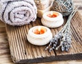 Spa and Wellness Setting on Wooden Background with Burning Candles and Lavander Bouquet Royalty Free Stock Photo