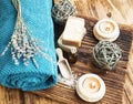 Spa and Wellness Setting on Wooden Background with Burning Candles , Essence Bottle and Homemade Soaps Royalty Free Stock Photo