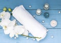 Spa with white towel, orchid, candle and oil. Health and relaxation