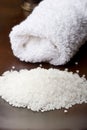 Spa white towel and sea bath salt for relaxation Royalty Free Stock Photo