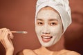 Spa Woman applying Facial clay Mask. Beauty Treatments Royalty Free Stock Photo