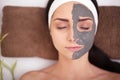 Spa Woman applying Facial cleansing Mask. Beauty Treatments Royalty Free Stock Photo