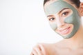 Spa Woman applying Facial cleansing Mask. Beauty Treatments Royalty Free Stock Photo