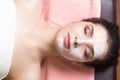 Portrait of woman patient in ayurveda spa wellness center lying relaxed Royalty Free Stock Photo