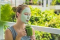 Spa Woman applying Facial green clay Mask. Beauty Treatments. Fr Royalty Free Stock Photo